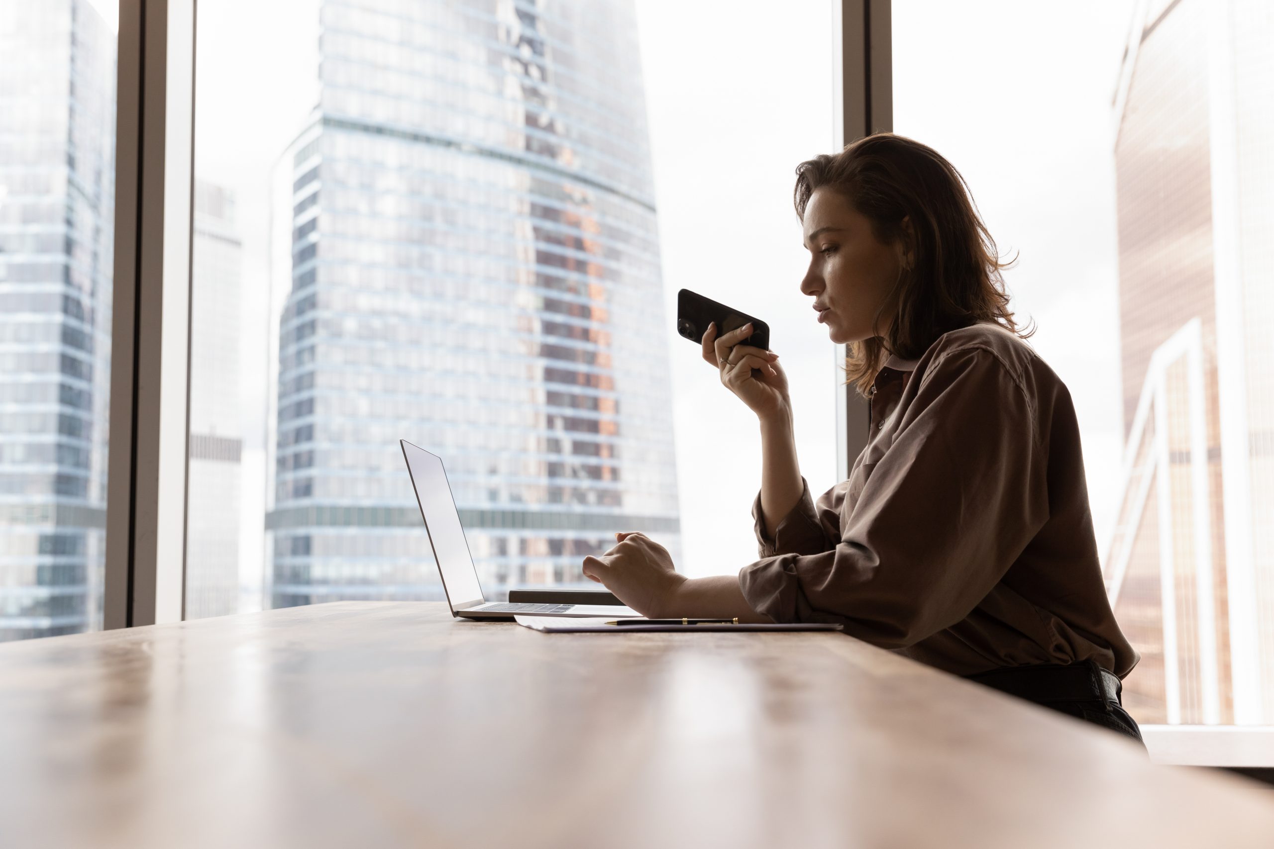Business Woman speaking into phone