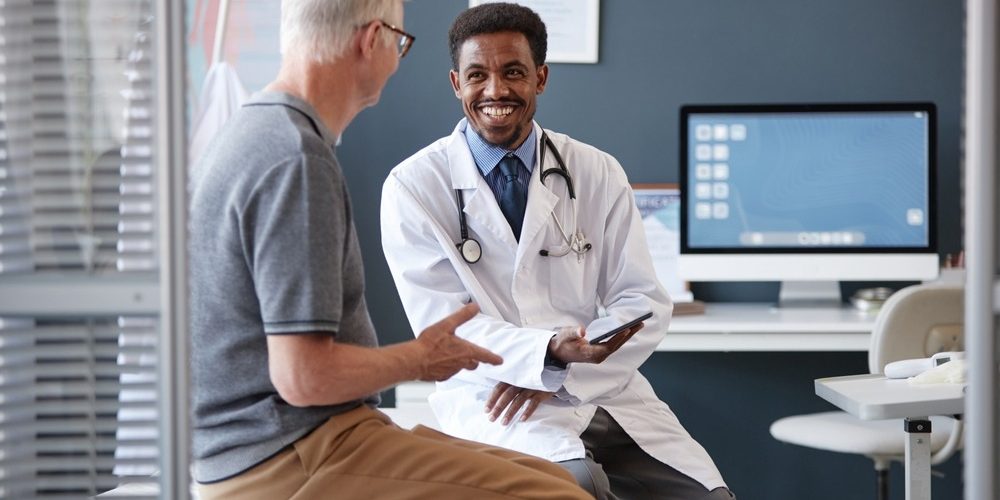 Waist,Up,Portrait,Of,Smiling,African,American,Doctor,Wearing,Lab